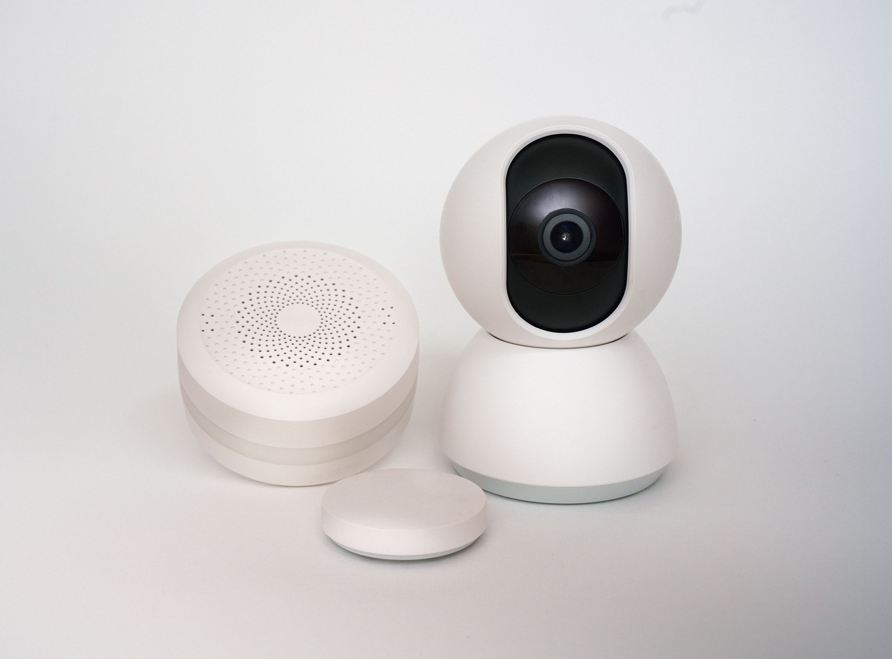 Modern white smart home security camera and sensor devices